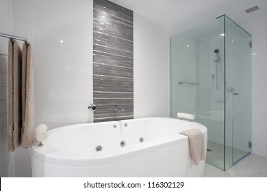 Stylish Clean Bathroom With Shower And Bath Tub