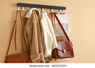 Stylish Clothes Hanging On Wall In Hall