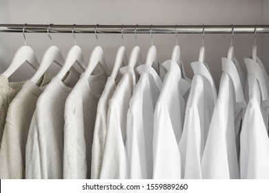 Stylish Clothes On Hangers In Show Room, Closeup