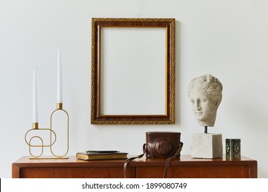 Stylish Composition Of Artist Workspace Room With Design Retro Teak Commode, Mock Up Poster Frame, Book, Decoration And Elegant Accessories. Template.