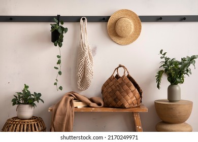 The Stylish Composition Of Cosy Entryway With Wooden Bench, Coffee Table, Basket, Hanger And Personal Accessories. Beige Wall. Home Decor. Template. 