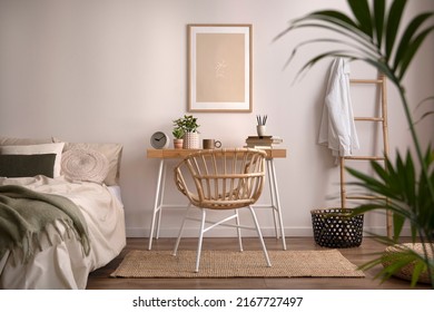 Stylish composition of cozy bedroom with mock up, beige bedding, plants, armchair and wooden desk. Mock up poster with wooden frame. Home decor. Template. 