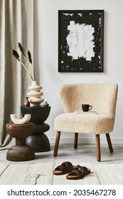 Stylish composition of cozy living room interior design with mock up poster frame, fluffy armchair, coffee table and personal accessories. Modern classic style. Template.