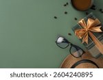 Stylish composition featuring a wrapped gift, a coffee cup, sunglasses, and a hat, perfect for occasions like Father