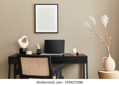 Stylish Composition Of Home Office Interior With Black Wooden Desk, Chair, Dried Flower In Vase, Laptop, Mock Up Poster Frame, Cup Of Coffee, Clock And Elegant Office Accessories. Template.