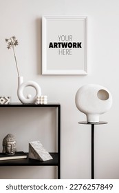 Stylish composition with mock up poster frame with black console, sculpture on the stand and personal accessories.