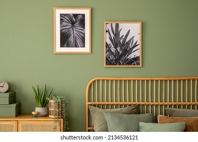 Stylish composition of modern bedroom interior. Mock up poster frames, rattan commode, bed and creative personal accessories. Eucalyptus wall. Template. Copy space.  - Powered by Shutterstock