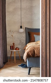 Stylish composition of modern bedroom interior. Bed, creative lamp and elegant personal accessories. Concrete wall. Brown sheeets. Minimalistic masculine concept. Template. - Shutterstock ID 2147808757