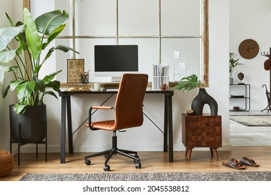 Stylish composition of modern masculine home office workspace interior design with black industrial desk, brown leather armchair, pc and stylish personal accessories. Template. - Shutterstock ID 2045538812