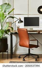 Stylish Composition Of Modern Masculine Home Office Workspace Interior Design With Black Industrial Desk, Brown Leather Armchair, Pc And Stylish Personal Accessories. Template.