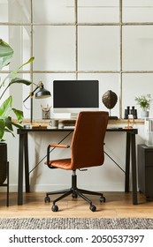 Stylish Composition Of Modern Masculine Home Office Workspace Interior Design With Black Industrial Desk, Brown Leather Armchair, Pc And Stylish Personal Accessories. Template.