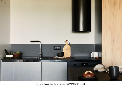 Stylish Composition Of Modern Small Dining Space Interior. Black Kitchen Island And Dining Accessories. Neutral Walls. Minimalistic Masculine Concept. Details. Template.