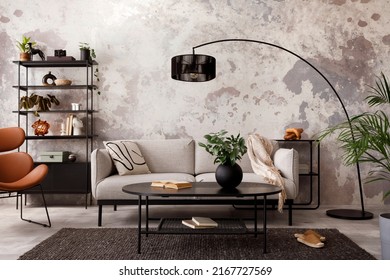 The stylish compostion at living room interior and design gray sofa  armchair  black coffee table  lamp   elegant personal accessories  Loft   industrial interior  Template  