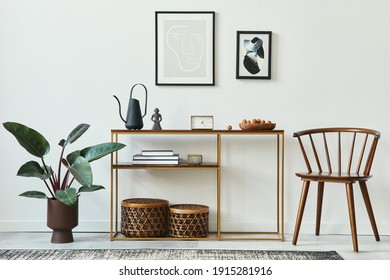 Stylish concept of living room interior with mock up poster frames, wooden console, chair, plant, rattan baskets, plant, carpet and personal accessories in home decor. Template. - Shutterstock ID 1915281916