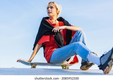 Stylish Cool Teen Female Skateboarder At Skate Park