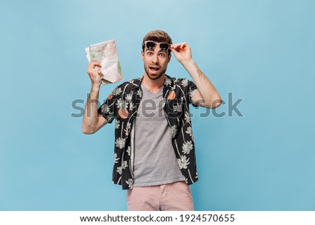 Man observing something through binoculars