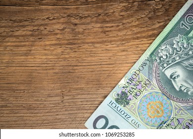 stylish copy space wint wooden background and polish zloty  bill