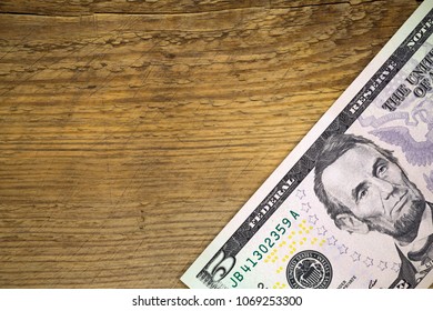 stylish copy space wint wooden background and five dollar bill