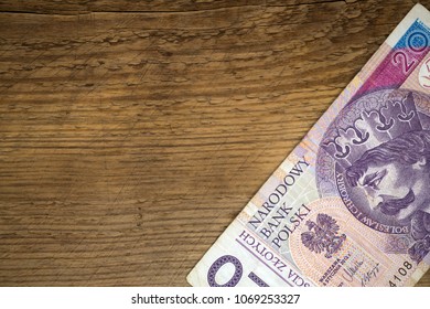 stylish copy space wint wooden background and polish zloty  bill