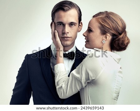 Stylish, couple and portrait in studio for vintage or retro fashion with classic old school look, elegant and glamour. Male person or playboy, woman and together for romance relationship and luxury.