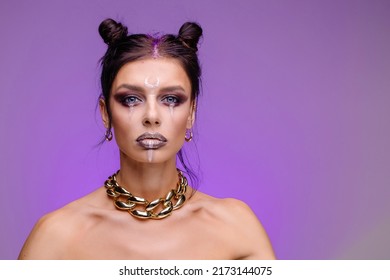 Stylish Creative Youth Halloween Costume. Modern Face Art. Masquerade Disco. Purple Violet Background Copy Space. Woman With Glamorous Makeup Portrait. Massive Accessory Chain. Strange Emotions