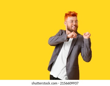 Stylish Dancing Young Man With Unusual Hair On Yellow Background