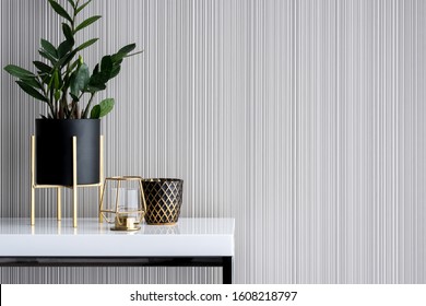 Stylish decoration in gold and black on white, high gloss console table - Shutterstock ID 1608218797
