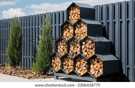 Stylish decorative firewood rack with cells in the form of honeycombs