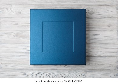 stylish designer square box for photo books...
cardboard box for a photo album.
Box for wedding album on the wooden background.
Gift box with lid. - Powered by Shutterstock