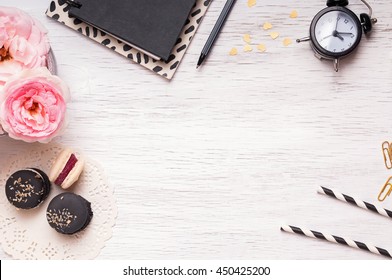 Stylish desktop with cute feminine essentials, top view