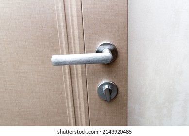 stylish doorknob and door in a design apartment. Copy space.