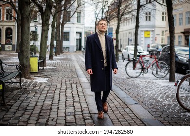 Stylish And Elegant Boy Walks Through The City Center On A Winter Day.