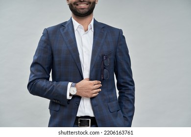 Stylish elegant fashionable young buisness man wearing suit standing isolated on beige background advertising formal wear fashion essentials store, accessories shops. Close up, copyscape for ads.