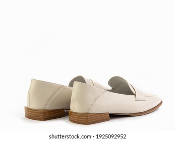 Stylish And Elegant Ivory Women's Loafers. Trendy Flat Leather Shoes With Square Toe And Beige Sole. Isolated Close-up On White Background. Back Side View. Fashion Shoes.