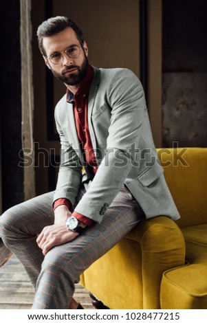 Similar – Thoughtful young man sitting on an urban bench