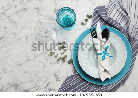 Stylish elegant table setting on marble background, top view. Space for text