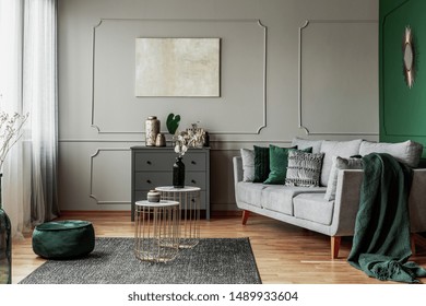 Stylish Emerald Green And Grey Living Room Interior Design With Abstract Painting On The Wall