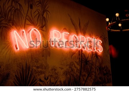 Stylish event interior featuring a glowing red neon sign with 