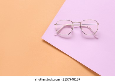 Stylish Eyeglasses On Color Background