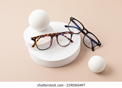 Stylish eyeglasses over pastel background. Optical store, glasses selection, eye test, vision examination at optician, fashion accessories concept. Top view, flat lay - Shutterstock ID 2190365497