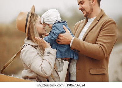 Stylish Family Walking On A Autumn Field