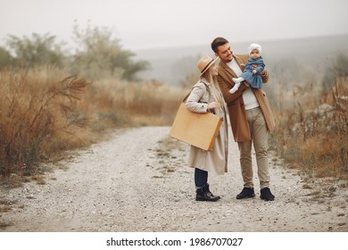 Stylish Family Walking On A Autumn Field