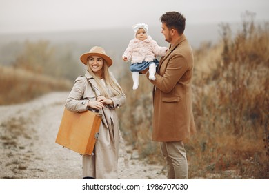 Stylish Family Walking On A Autumn Field