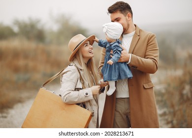 Stylish Family Walking On A Autumn Field