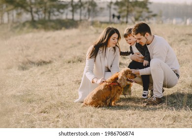 Stylish Family Walking On A Spring Field