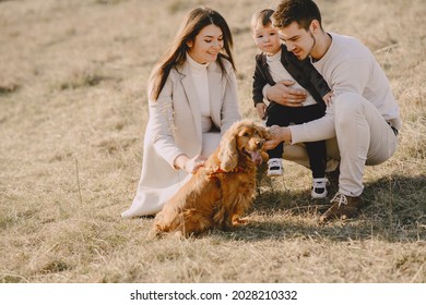 Stylish Family Walking On A Spring Field