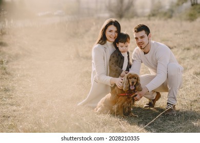 Stylish Family Walking On A Spring Field