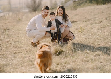 Stylish Family Walking On A Spring Field