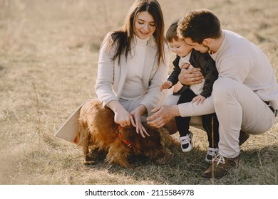 Stylish Family Walking On A Spring Field