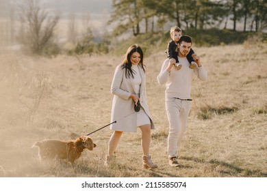 Stylish Family Walking On A Spring Field